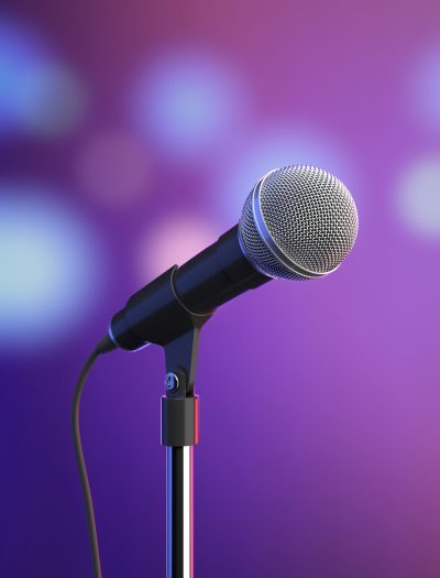 Microphone on stage with blurred lights. 3D illustration